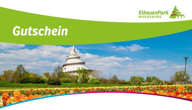 Panorama mit bunten Blumenfeldern im Vordergrund und dem Jahrtausendturm im Hintergrund