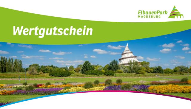 Panorama mit bunten Blumenfeldern im Vordergrund und dem Jahrtausendturm im Hintergrund